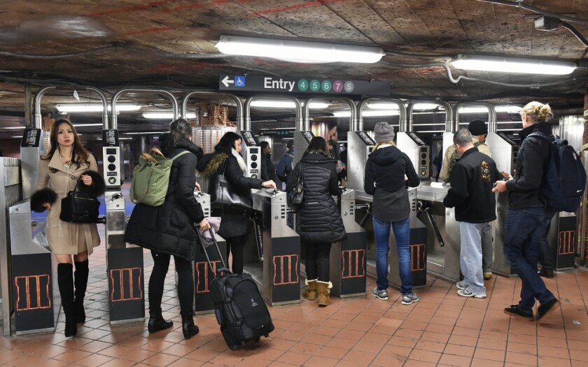 New,York,City,-,Nov,17:,Commuters,Pass,Through,A