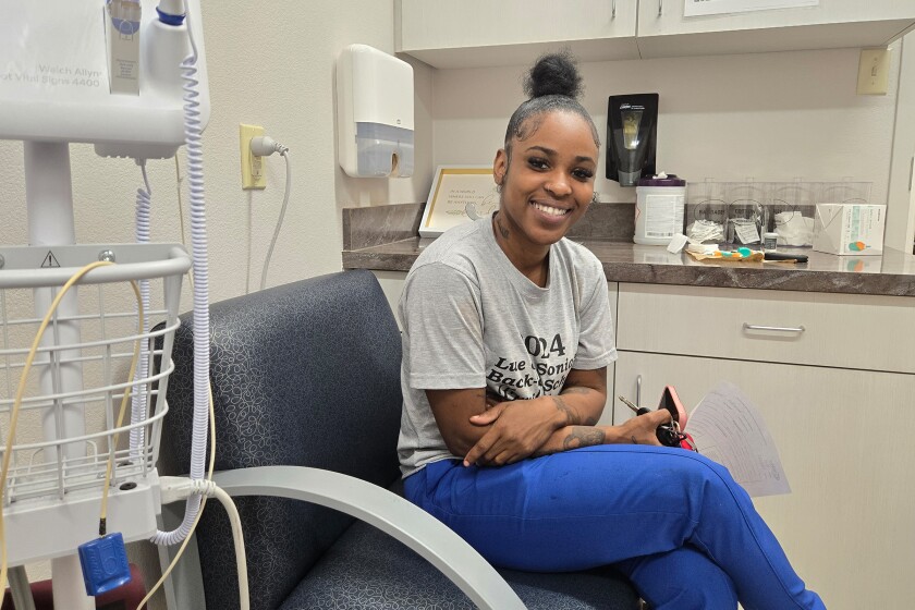 Dominique Youngblood waits for a dental checkup at the David Raines Community Health Center in Bossier City, Louisiana. She says she’s had Medicaid most her life and fears what would happen if she lost coverage for herself and her two children. (Phil Galewitz/KFF Health News/TNS)