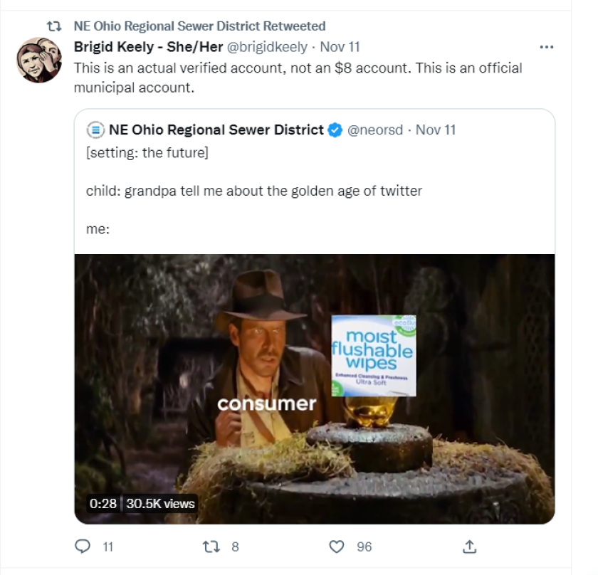 A NEORSD tweet that reads “setting: the future. Child: grandpa tell me about the golden age of twitter. Me: [below that text is a movie screen shot of Indiana Jones inside a cave, staring at an item on a stone pedestal. The word “consumer” is typed over Jones and the image of a box of moist flushable whites is pasted over the item.]” &#13&#10&#13&#10Another Twitter user has retweeted this, commenting, “This is an actual verified account, not an $8 account. This is an official municipal account.”