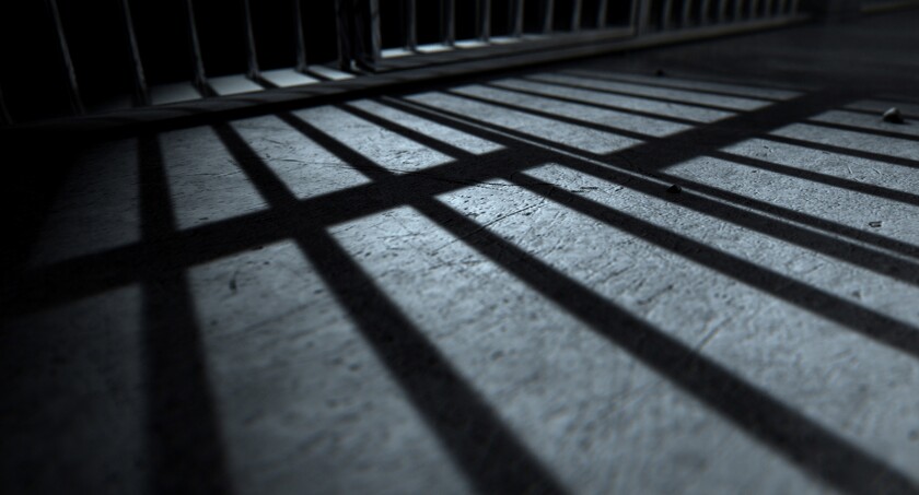 shadows of prison cell bars