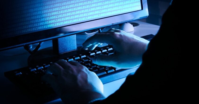 a hacker launching a malware attack