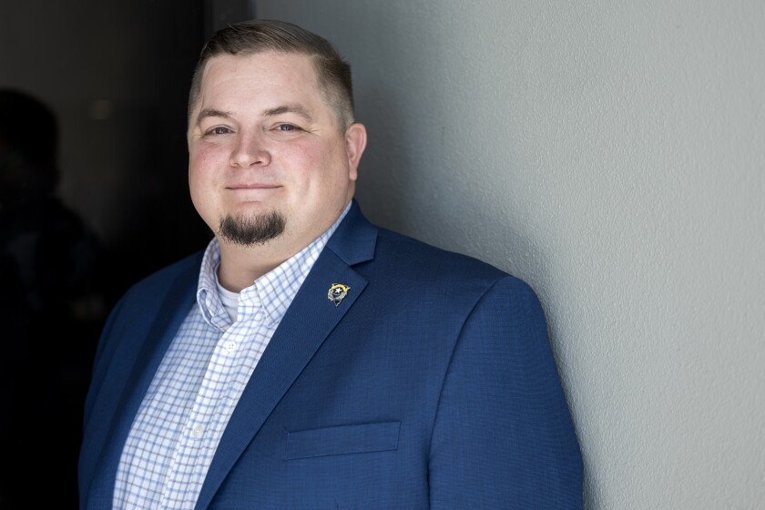 State Tech Leaders On The Trends Of 2023 Nevada Chief Information Officer Timothy Galluzi In A Blue Suit Against A Gray Background.