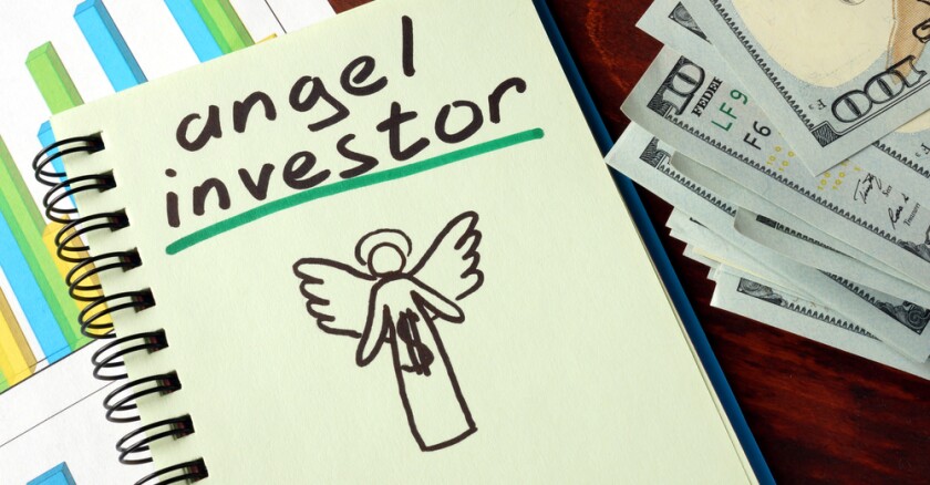 A notebook with angel investor sign.