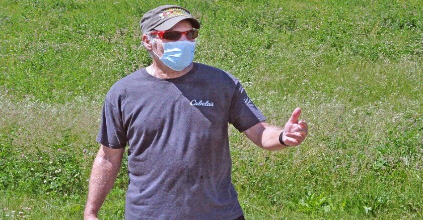 A retired Wooster City firefighter wears his mask