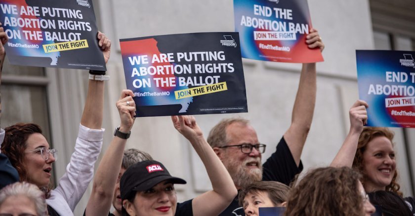 Attendees cheer during a Missourians for Constitutional Freedom rally