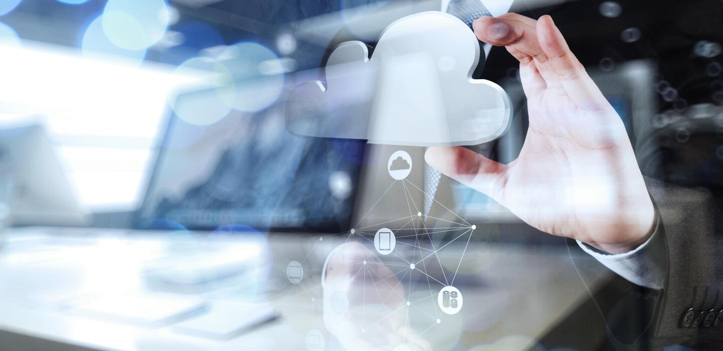 Double exposure of Businessman hand working with a Cloud Computing diagram on the new computer interface as concept