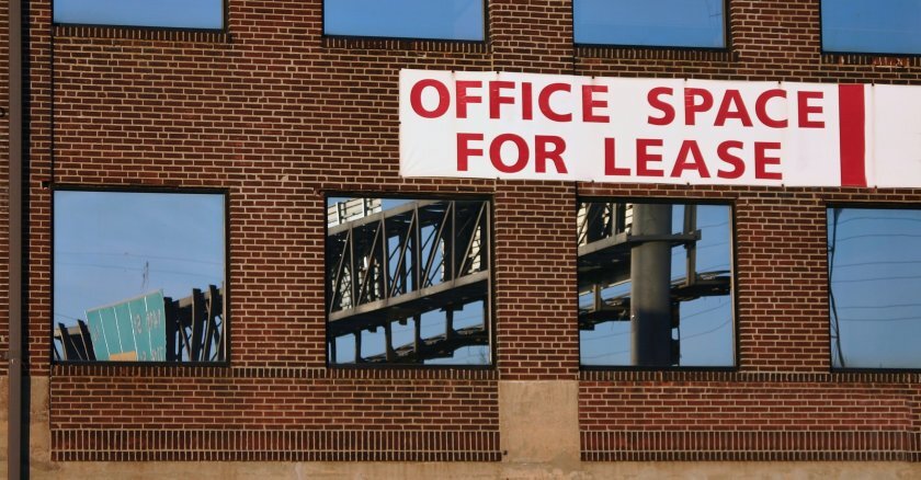 For-lease sign on office building