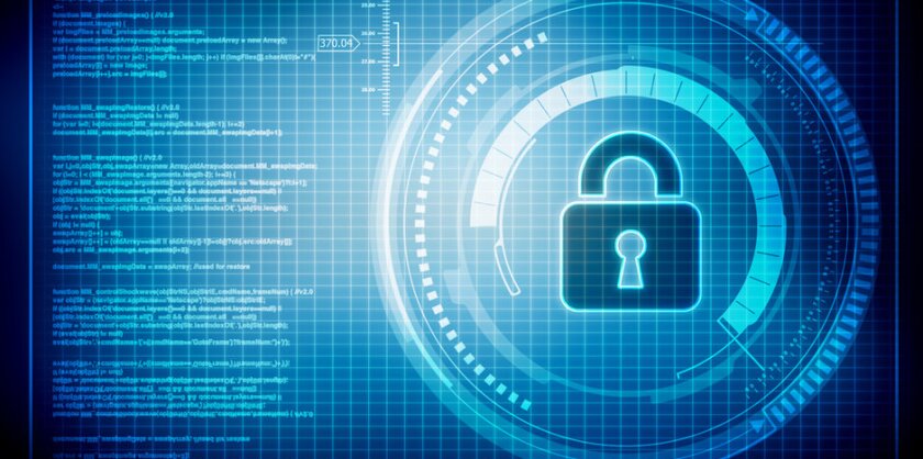 A digital image of a lock on a screen next to lines of code.