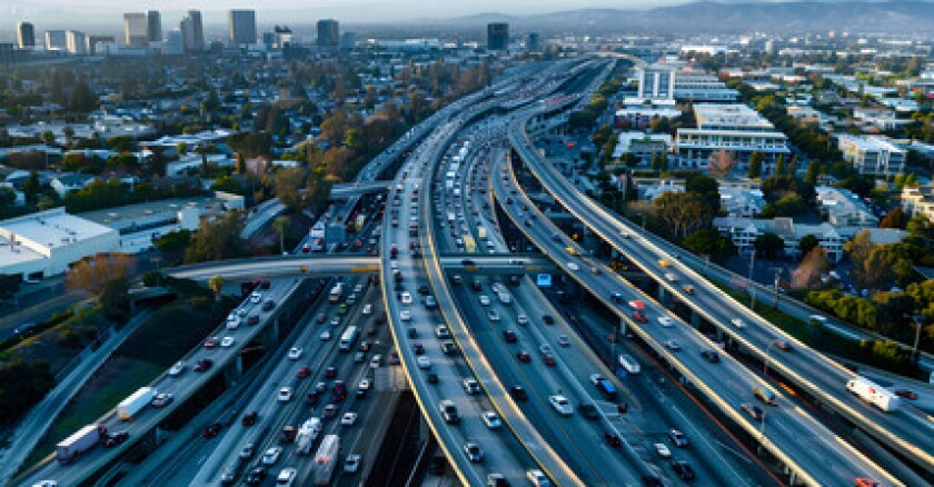 Aerial view of traffic on a large freeway interchange in San Jose, Calif.