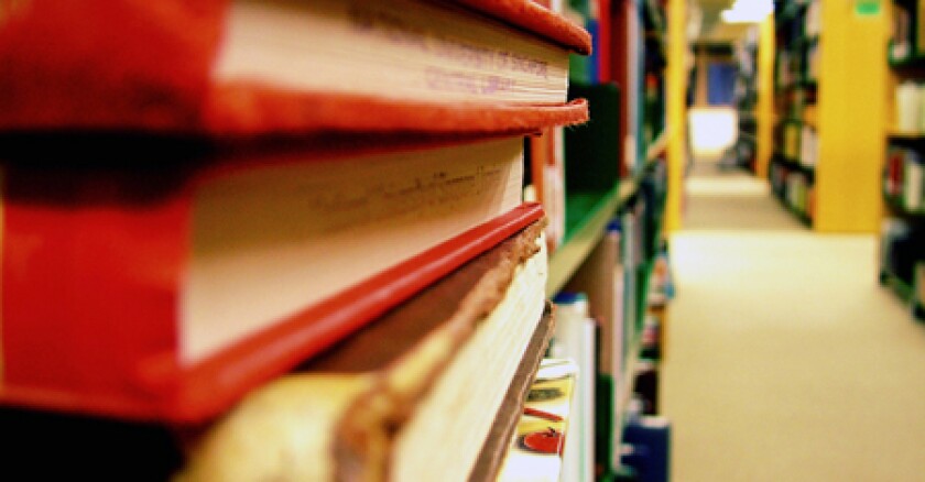 Library books with stacks in background