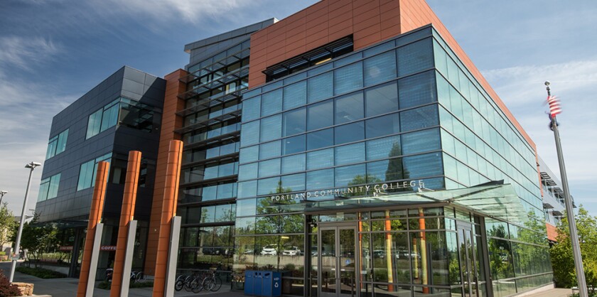 The exterior of the Portland Community College Willow Creek Center, which is largely glass from this angle, on a sunny day.