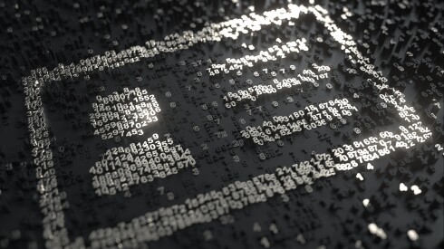 Black and silver raised numbers against a black surface, with the silver numbers arranged in the form of an ID card.