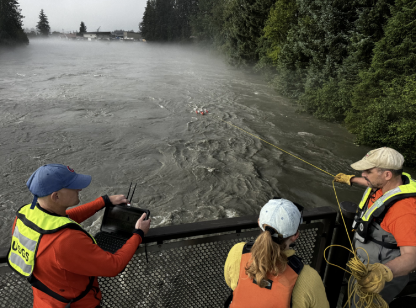 U.S. Geological Survey scientists measure flooding on the Mendenhall River
