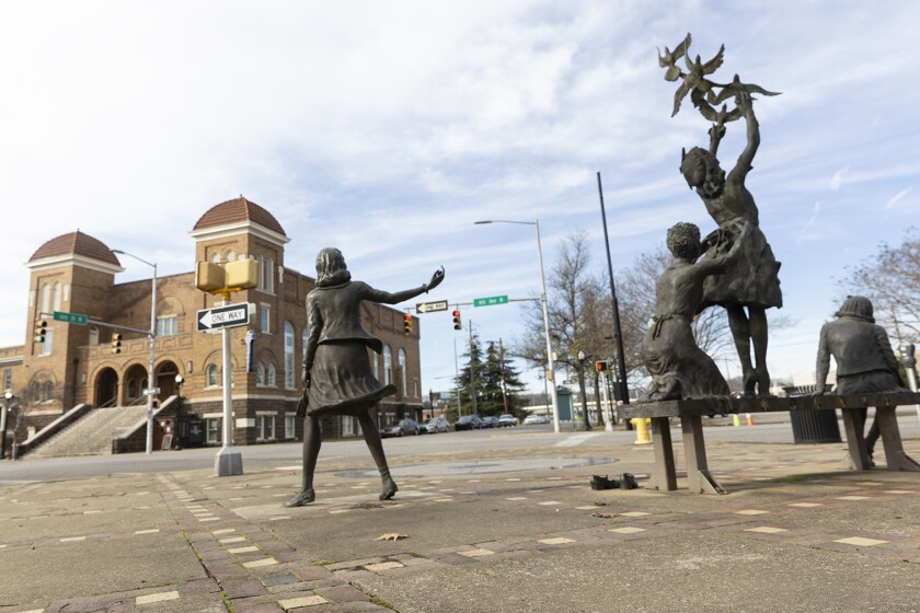 A statue of the four girls as a monument that was installed across from the church on the 50th anniversary of the bombing.