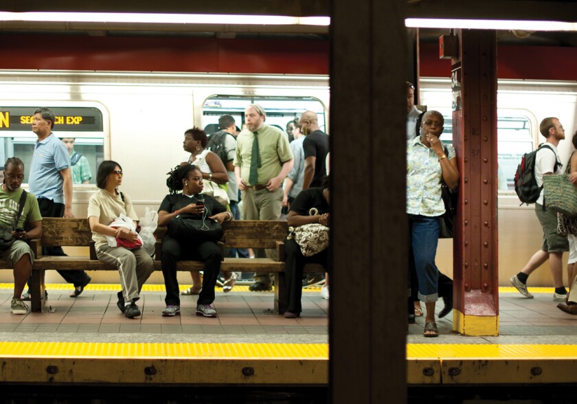 Commuters waiting on a New York City subway platform