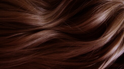 Closeup of long, wavy red hair.