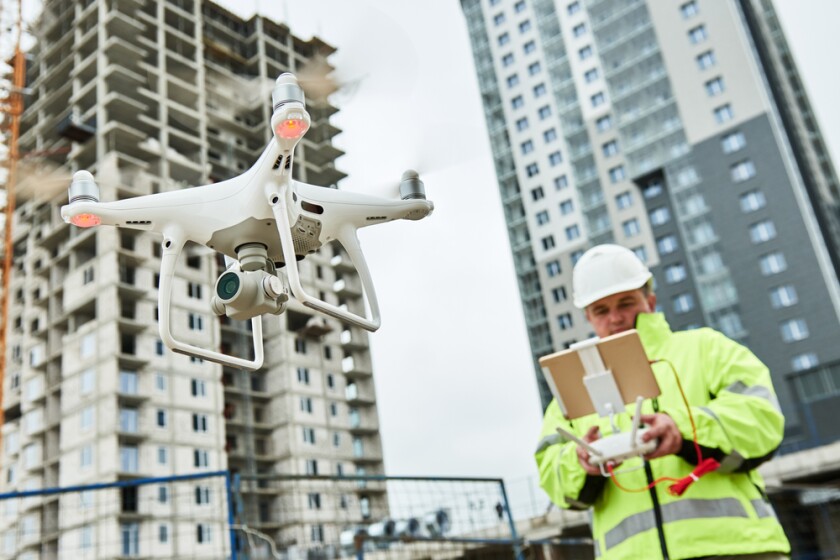 A+drone+being+operated+at+a+construction+site