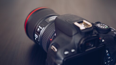Dslr,Camera,Isolated,On,A,Black,Background.,Black,Dslr,Camera