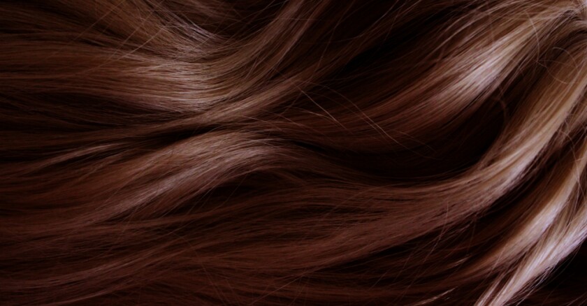 Closeup of long, wavy red hair.