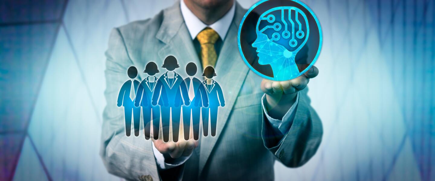 Unrecognizable male business manager raising artificial intelligence above a work team. Technology concept for AI, machine and deep learning, robolution, digital transformation of the workforce.