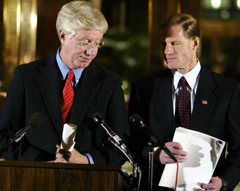 Tom Miller, at the microphone, speaks at an event in 2002 alongside Richard Blumenthal, then the attorney general of Connecticut