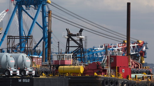 Brightly colored loading equipment is visible at the Port Authority of New York and New Jersey.