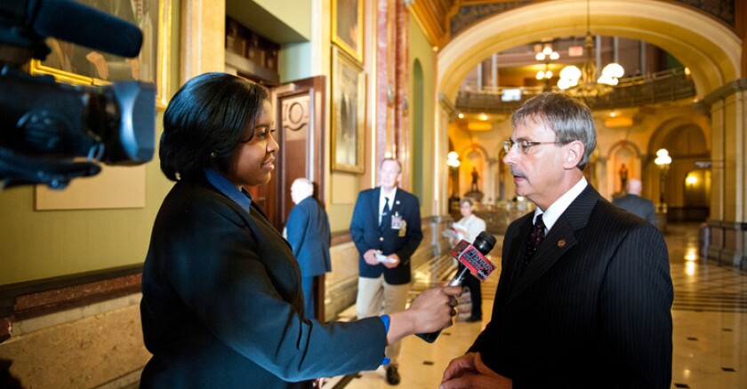 A reporting intern conducts an interview inside the Illinois Capitol.