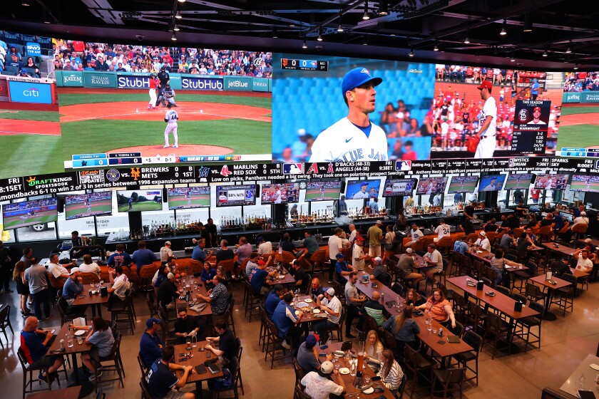 Aerial view of people place bets at DraftKings Sportsbook, which is attached to Wrigley Field, before a ballgame in 2023.
