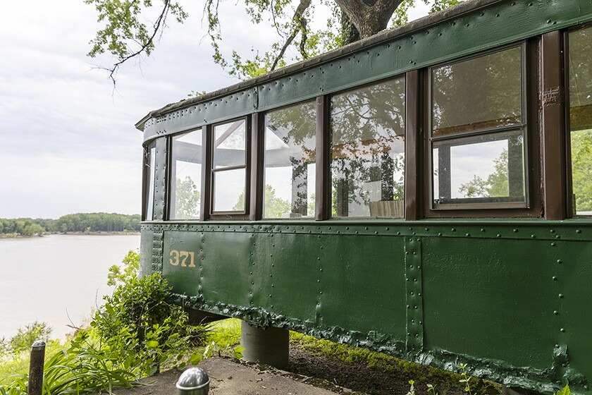 A repurposed streetcar overlooking the Ohio River.