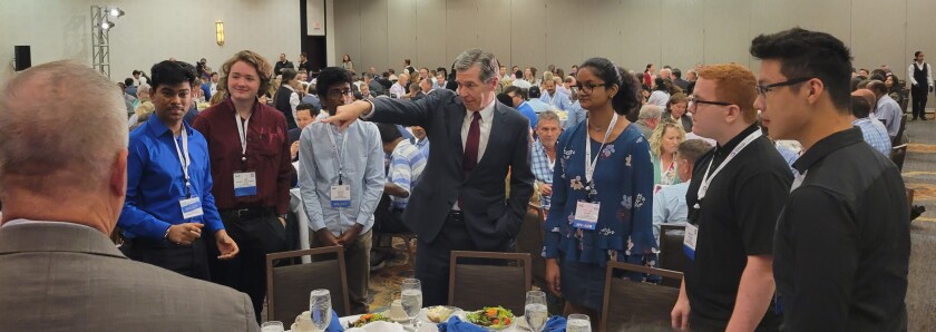 North Carolina Gov. Roy Cooper meets with CyberStart America participants at the Government Technology North Carolina Digital Government Summit in 2022.