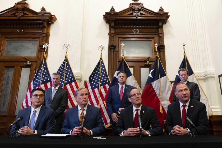 gov. greg abbott signs the Senate Bill 2 and Senate Bill 3 at the Texas Capitol