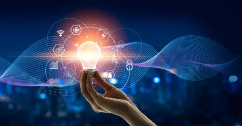 A hand holding up a light bulb surrounded by digital symbols for networks and security. A blue background has blue digital lines that twist into a wavy pattern.