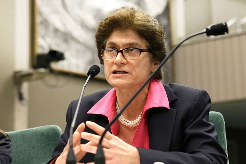Elaine M. Howle speaking into a microphone.