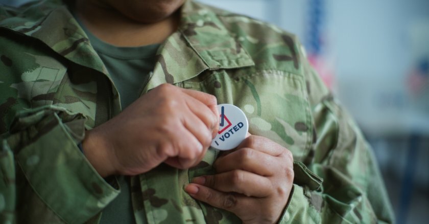 Military member with "I Voted" pin