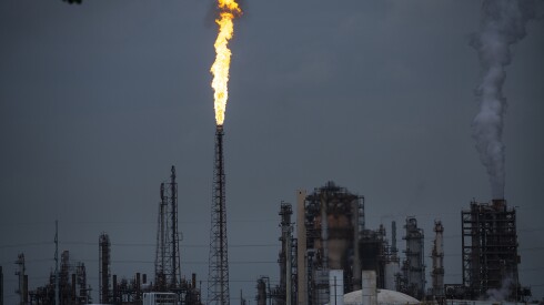 A gas flare from the Shell Chemical LP petroleum refinery illuminates the sky on Aug. 21, 2019, in Norco, Louisiana.  (Drew Angerer/Getty Images/TNS)