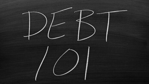 Chalkboard with "DEBT 101" written on it.