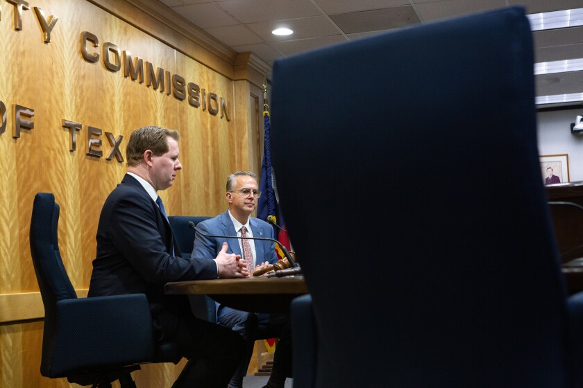 Public Utility Commission and ERCOT officials speak at a press conference