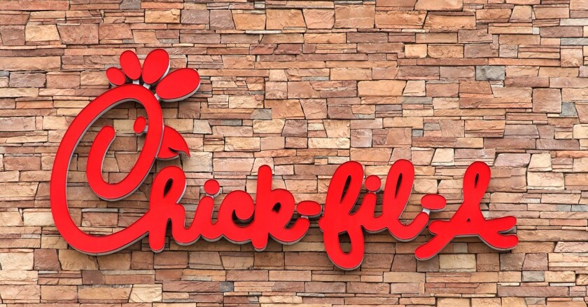 Chick-fil-a sign on side of a building