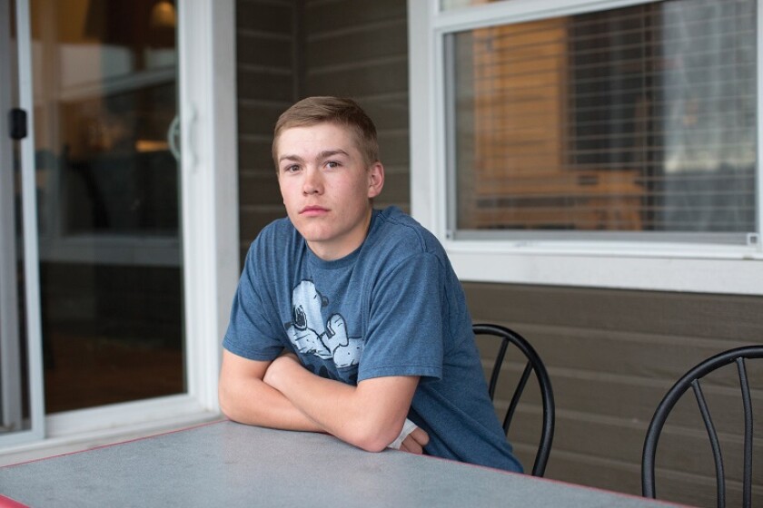 Kaleb Gourley sitting at a table