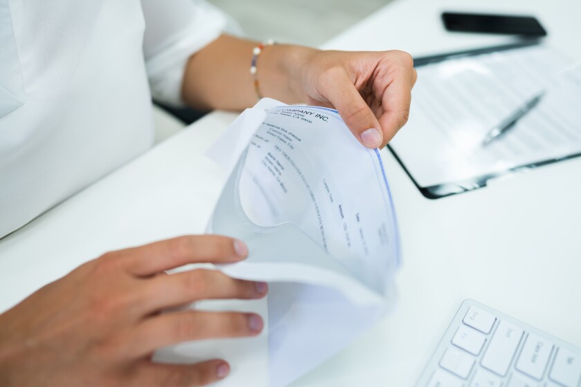 a person opening a check