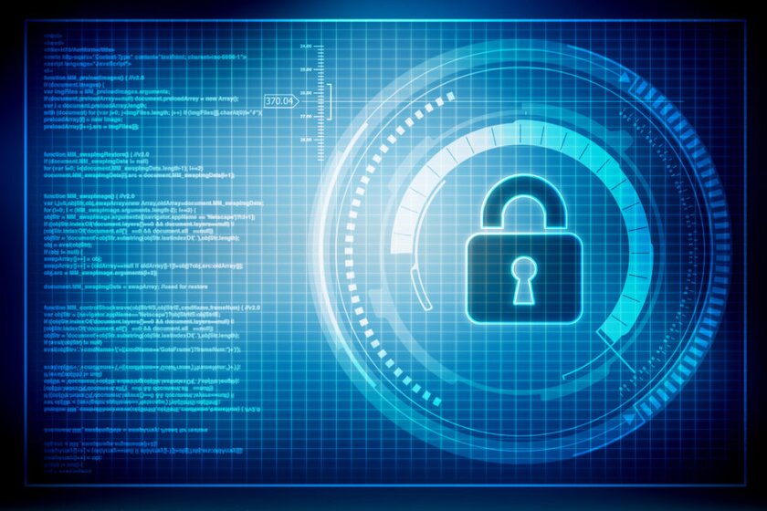 A digital image of a lock on a screen next to lines of code.