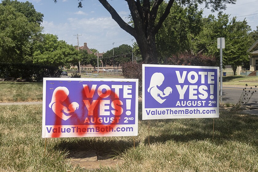 A pro-amendment yard sign that was defaced by opponents.
