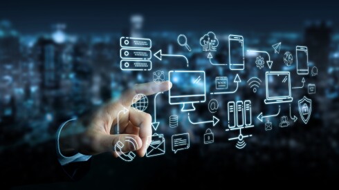 Businessman,On,Blurred,Background,Using,Tech,Devices,And,Icons,Thin