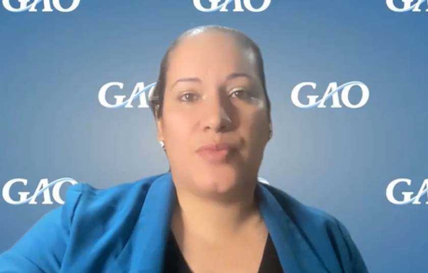 Head and shoulders view of Marisol Cruz Cain, in front of a "GAO" background.