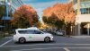 A Waymo driverless taxi on a city street.