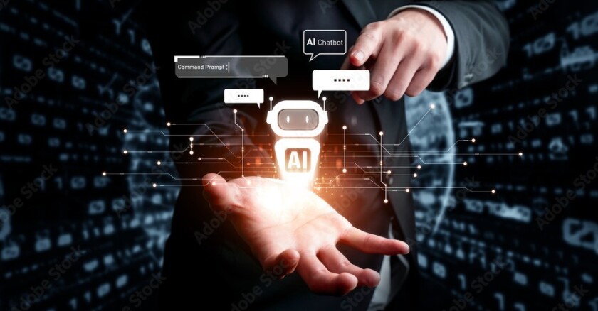 A person holding out their hand with a symbol of a robot hovering above their palm. The robot has "AI" written on it. Dark background.