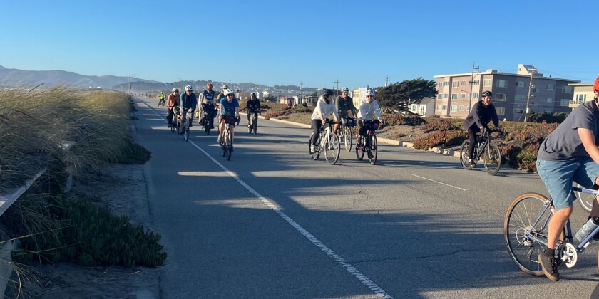 Bicycle riders along the Great Highway in San Francisco.