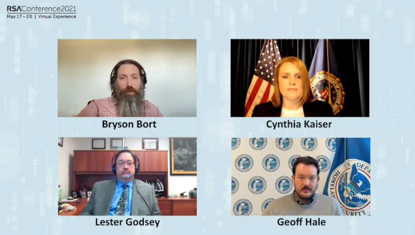 Four people on a computer screen speaking as a virtual panel.