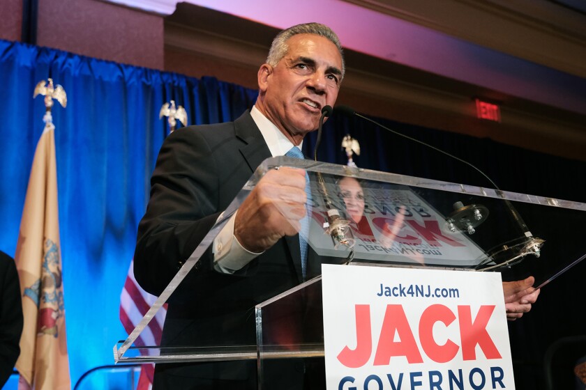 New Jersey Republican gubernatorial candidate Jack Ciattarelli standing behind a podium and speaking into a microphone.
