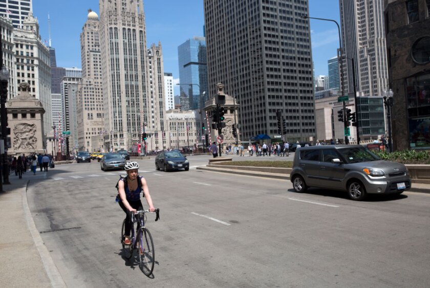cyclist+on+a+busy+street+in+Chicago